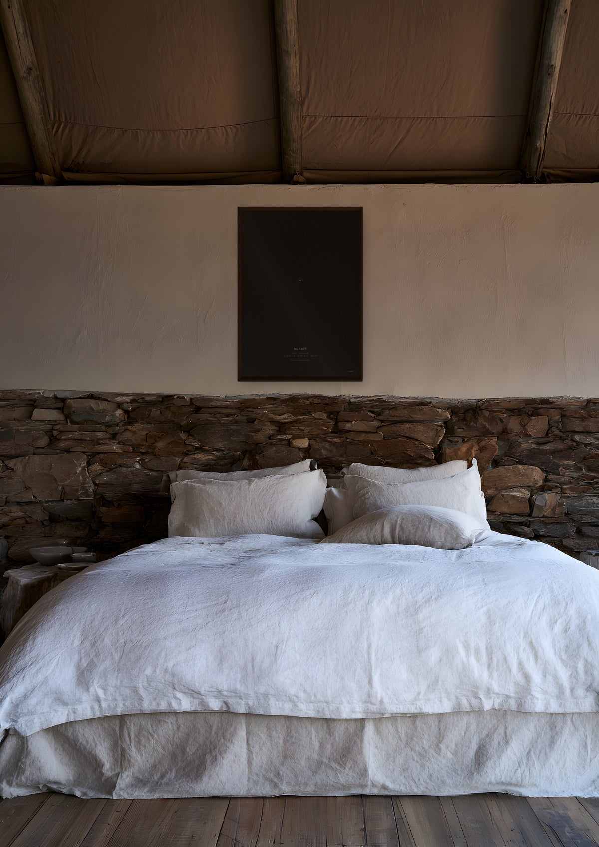 Altair in a dark wood frame, shown in namibia-lodge-bedroom