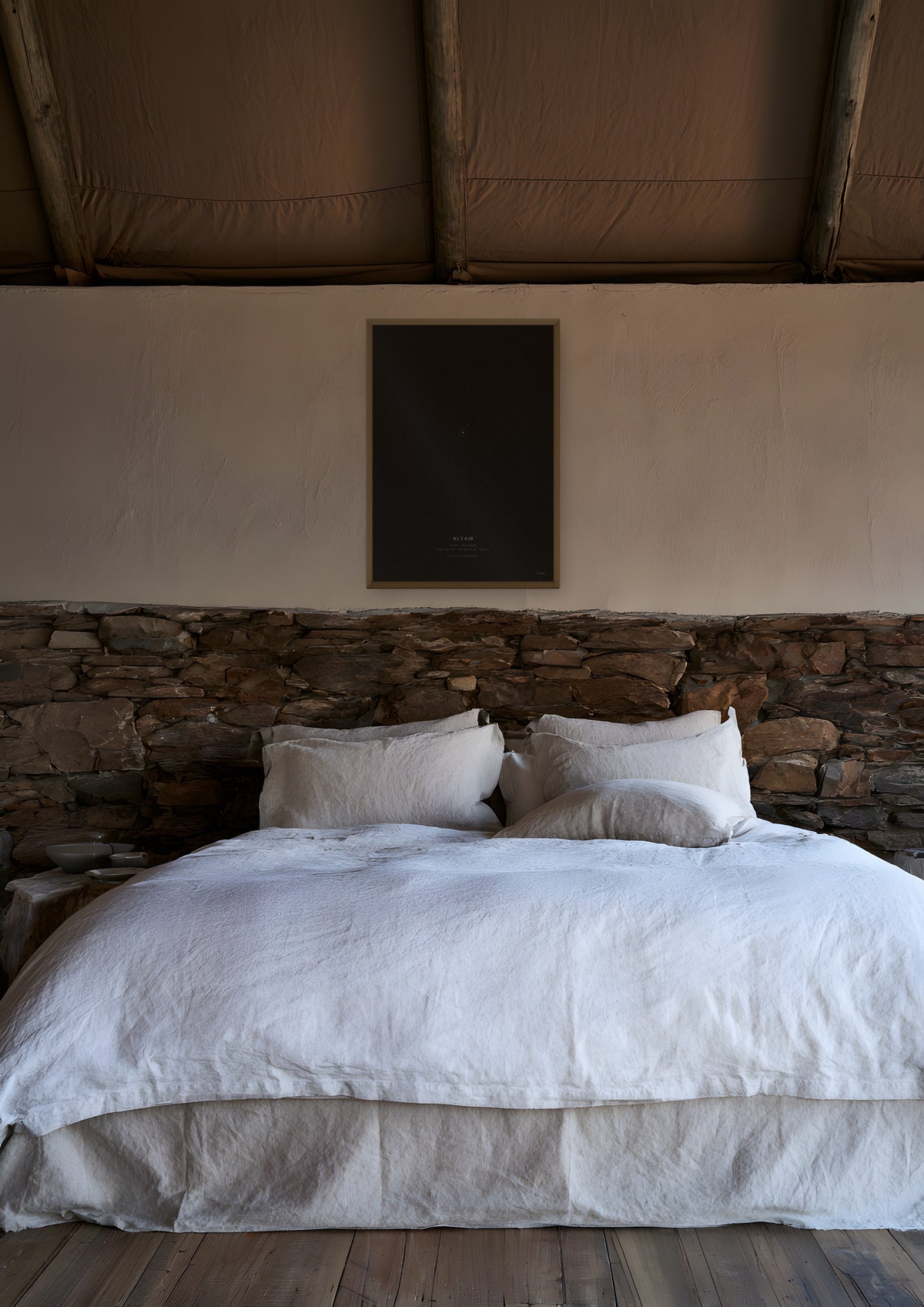 Altair in a natural wood frame, shown in namibia-lodge-bedroom
