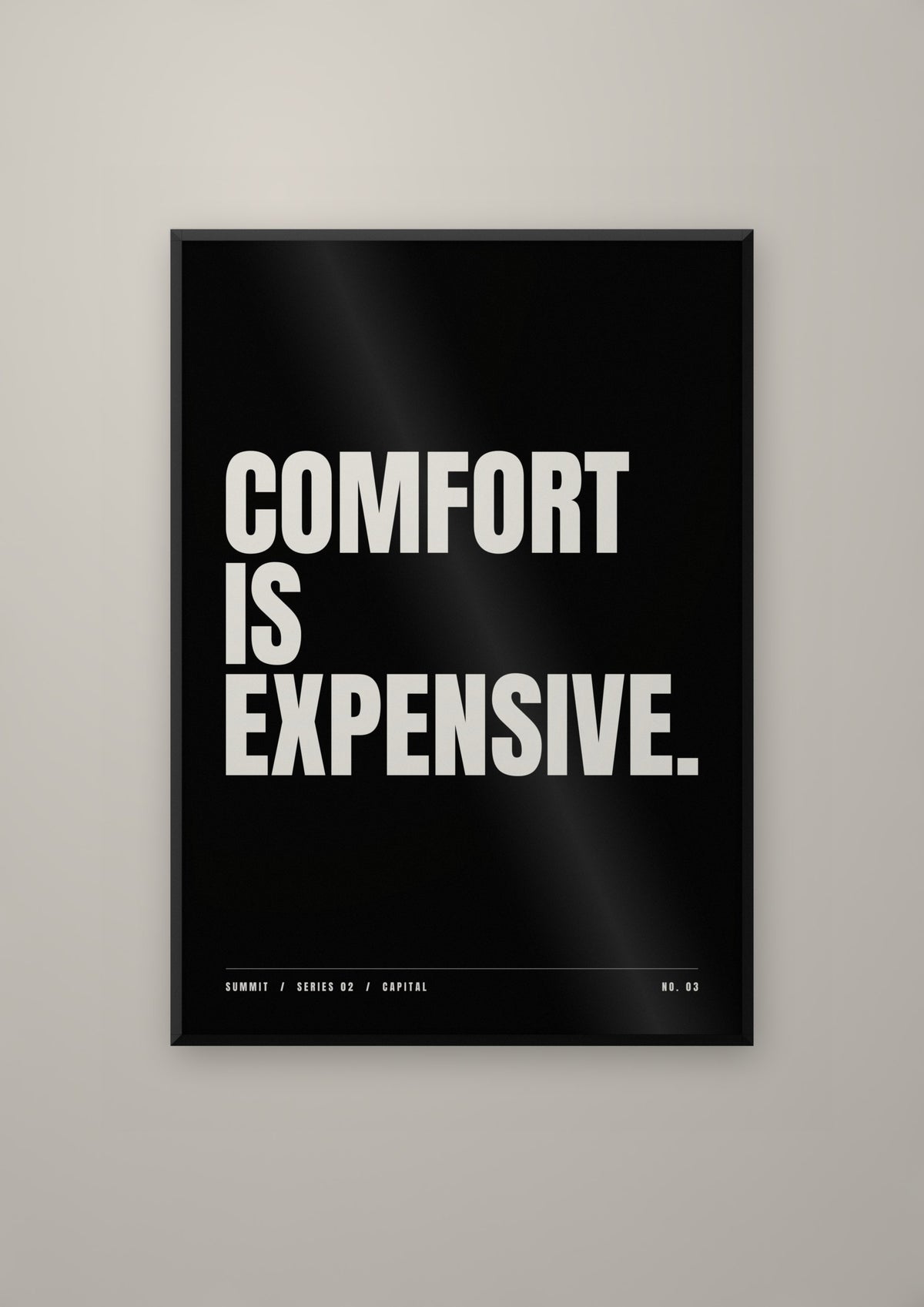 Comfort Is Expensive in a black frame