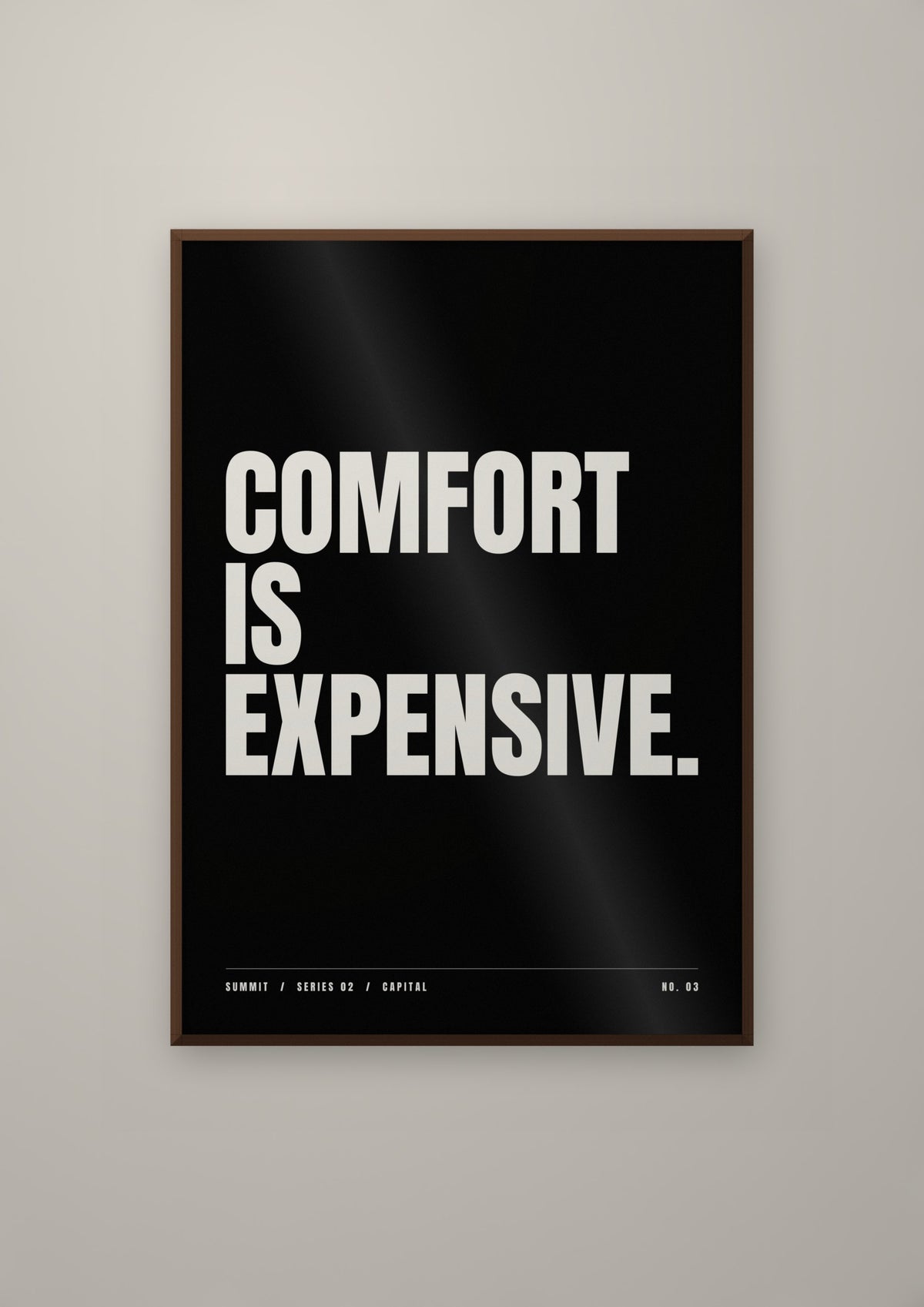 Comfort Is Expensive in a dark wood frame