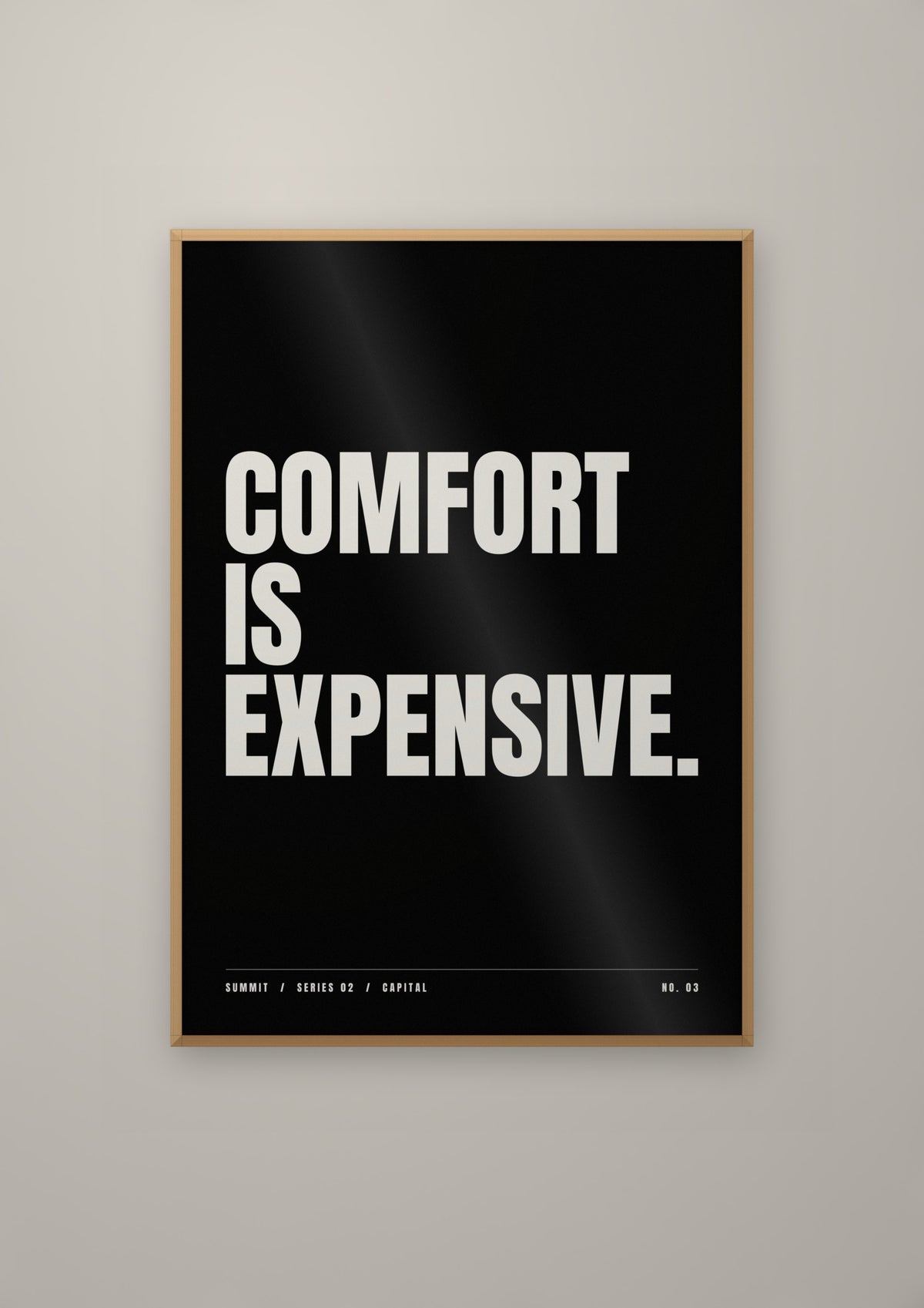 Comfort Is Expensive in a natural wood frame