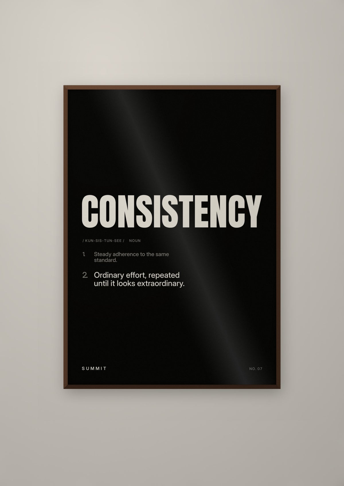 Consistency, Defined (Black) in a dark wood frame