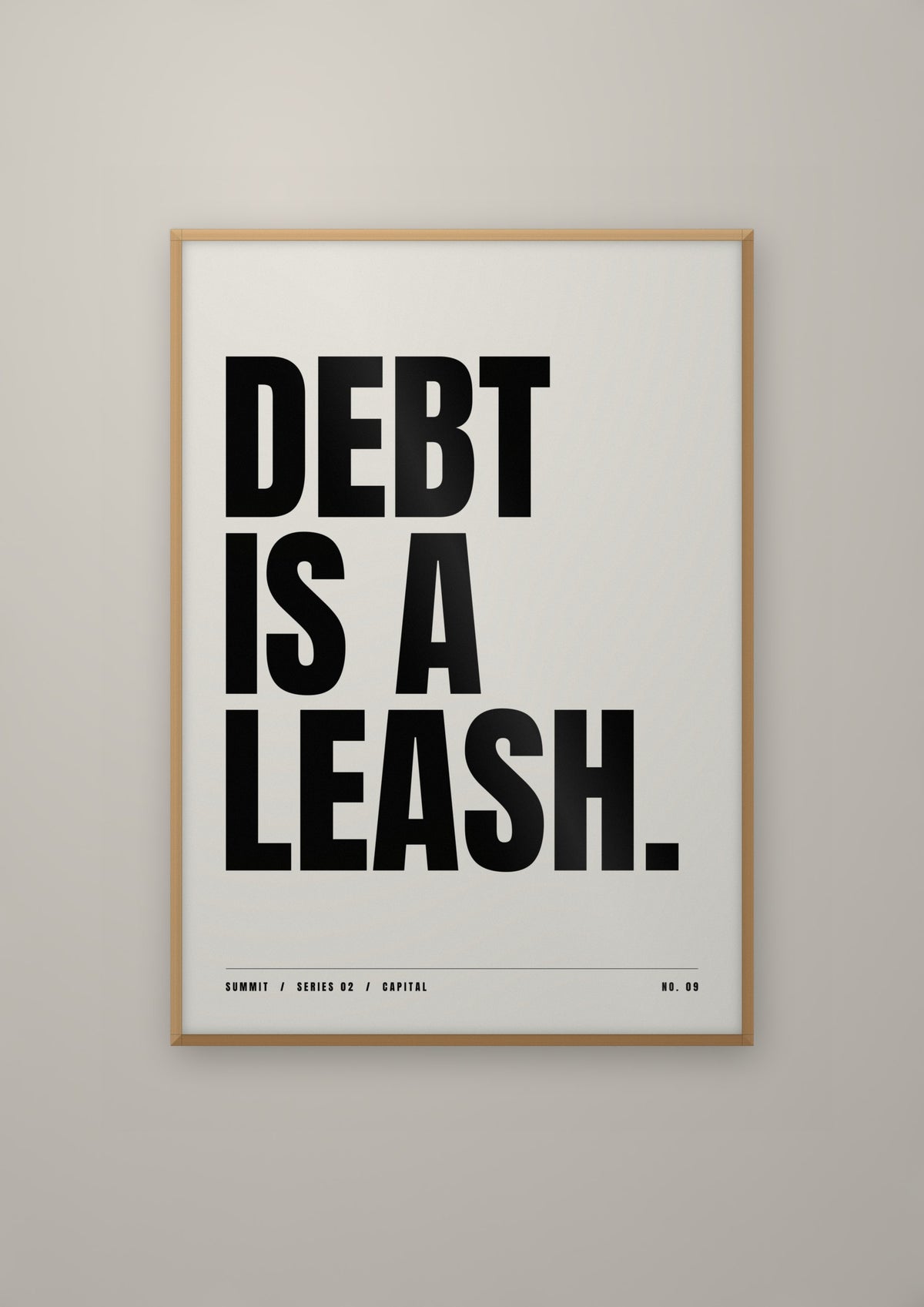 Debt Is a Leash in a natural wood frame