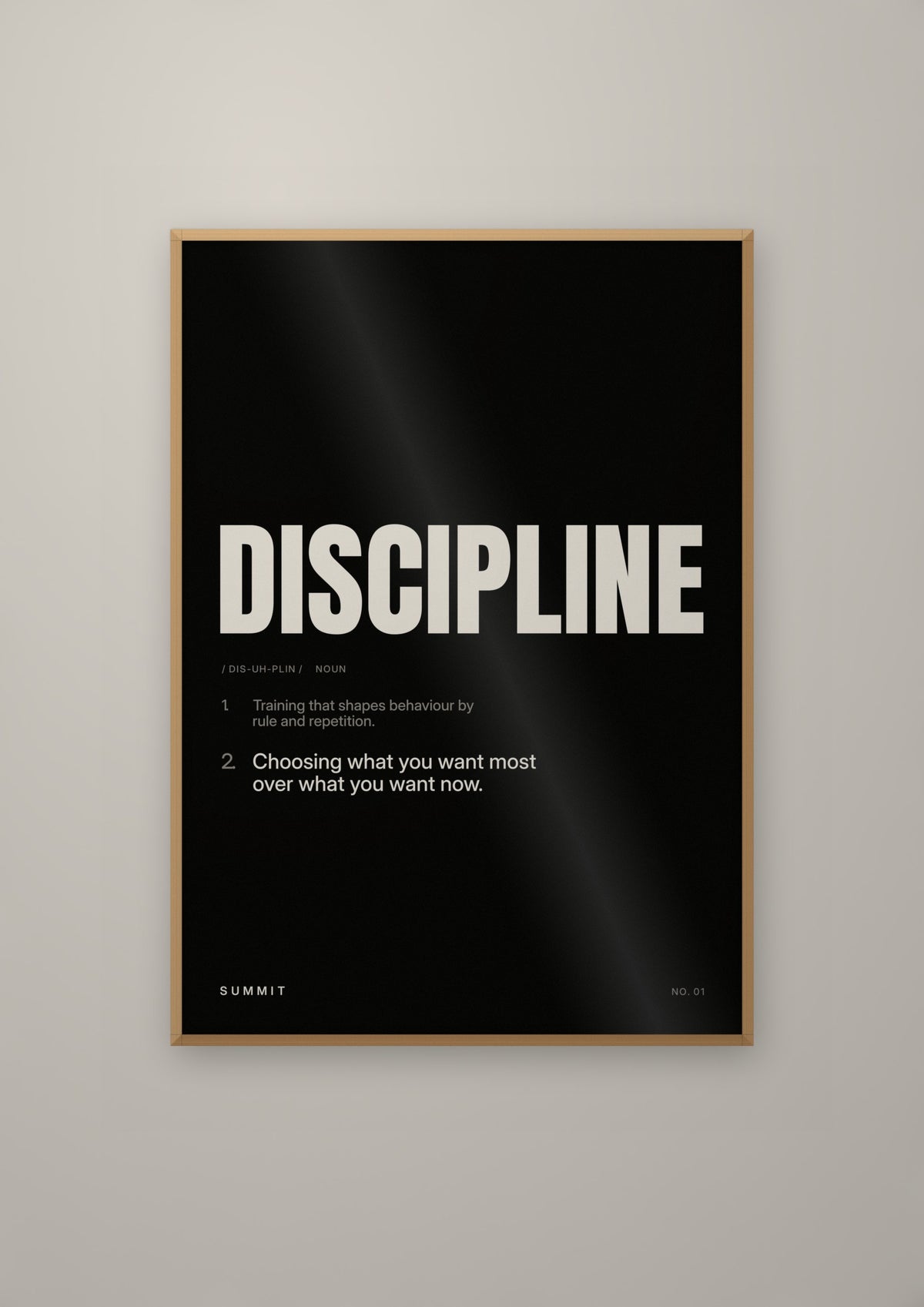 Discipline, Defined (Black) in a natural wood frame