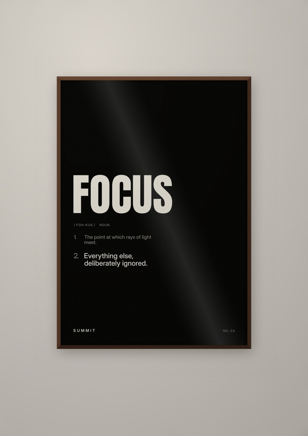 Focus, Defined (Black) in a dark wood frame