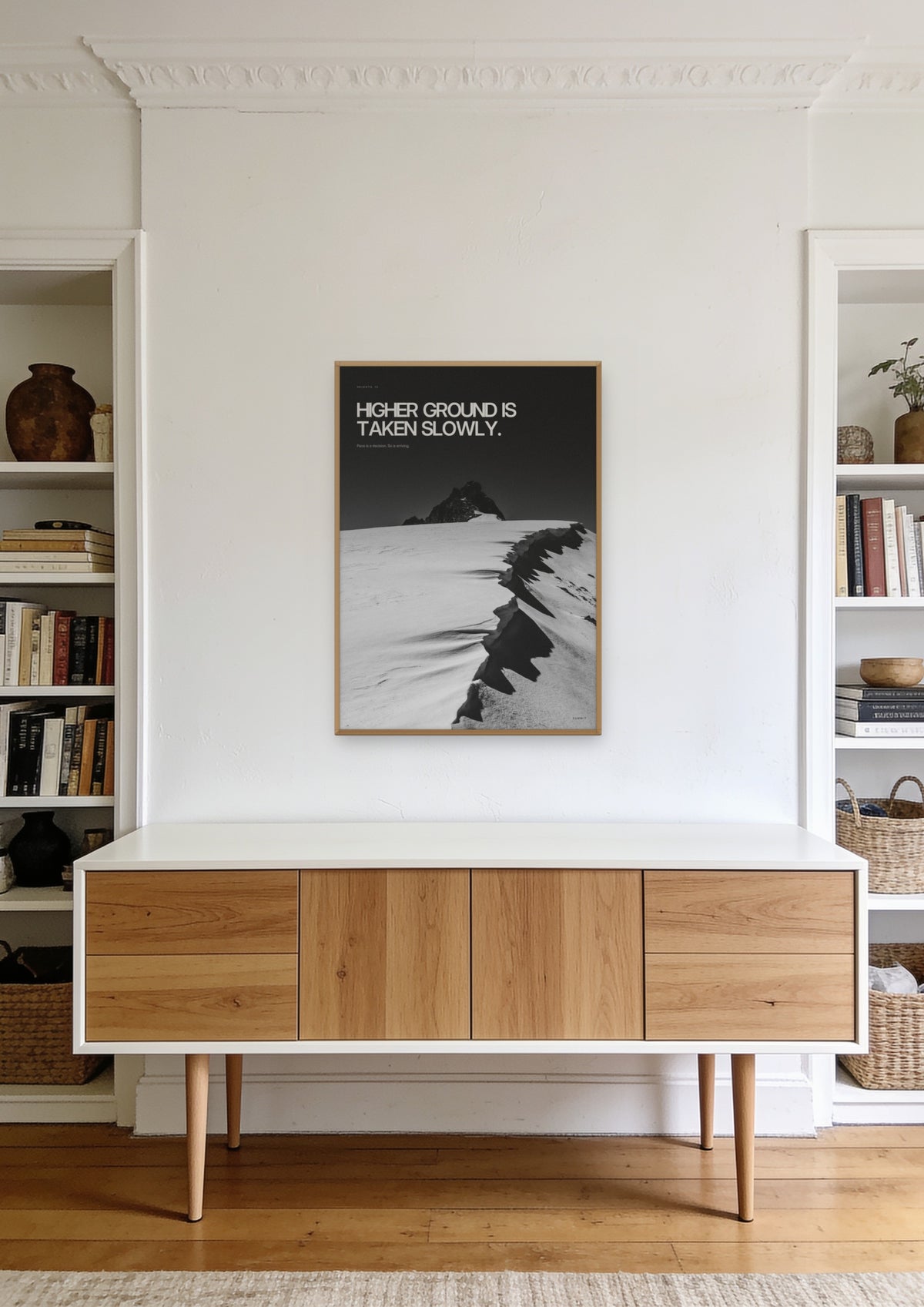 Higher Ground in a natural wood frame, shown in a founder's office