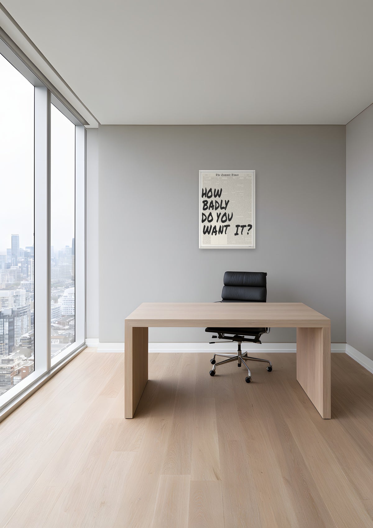 How Badly Do You Want It? in a white frame, shown in toronto-condo-office