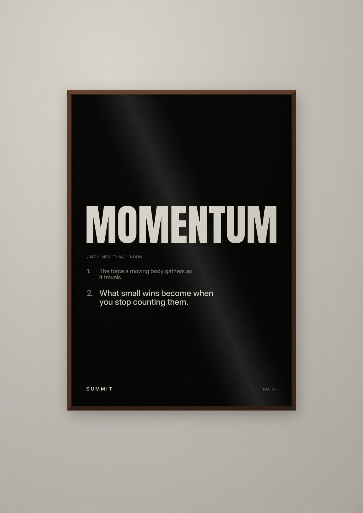 Momentum, Defined (Black) in a dark wood frame