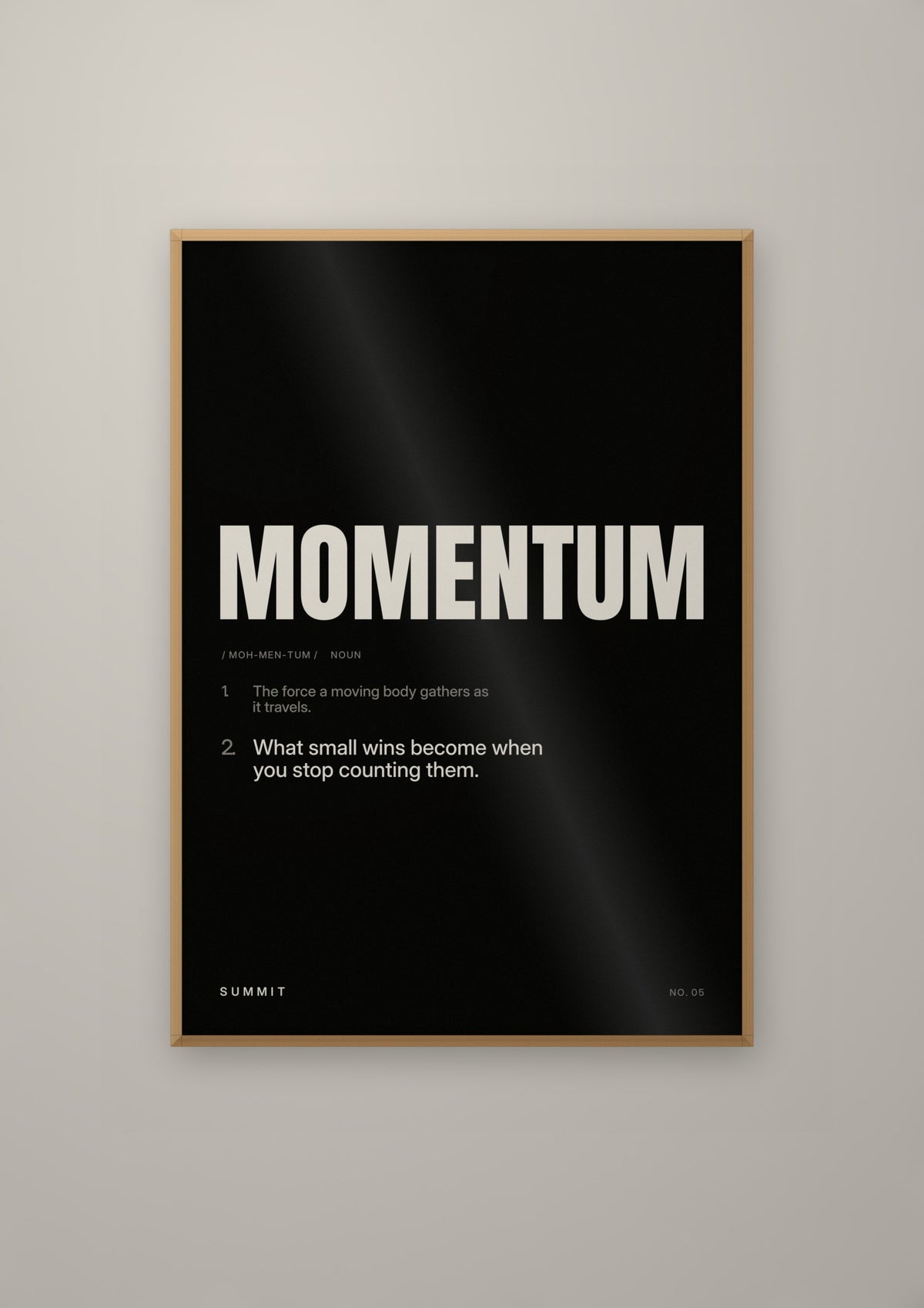 Momentum, Defined (Black) in a natural wood frame