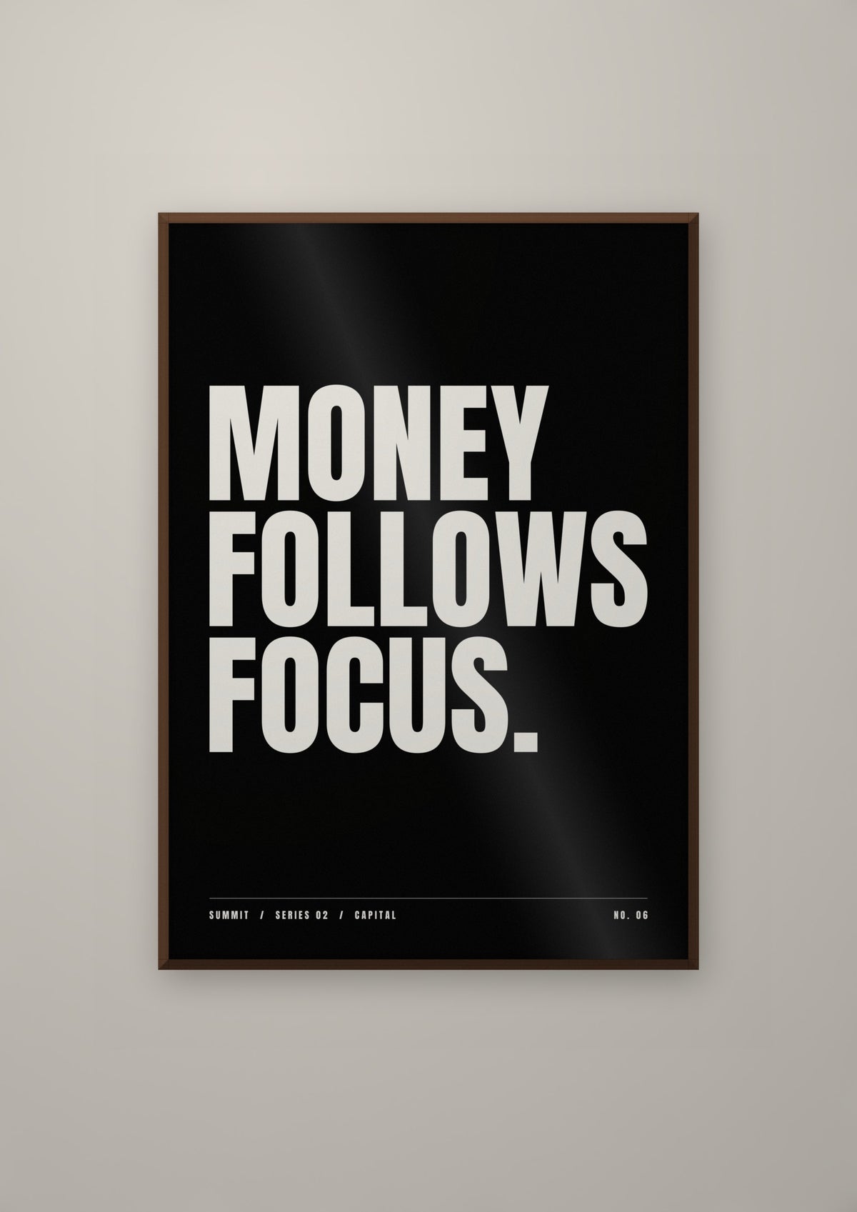 Money Follows Focus in a dark wood frame