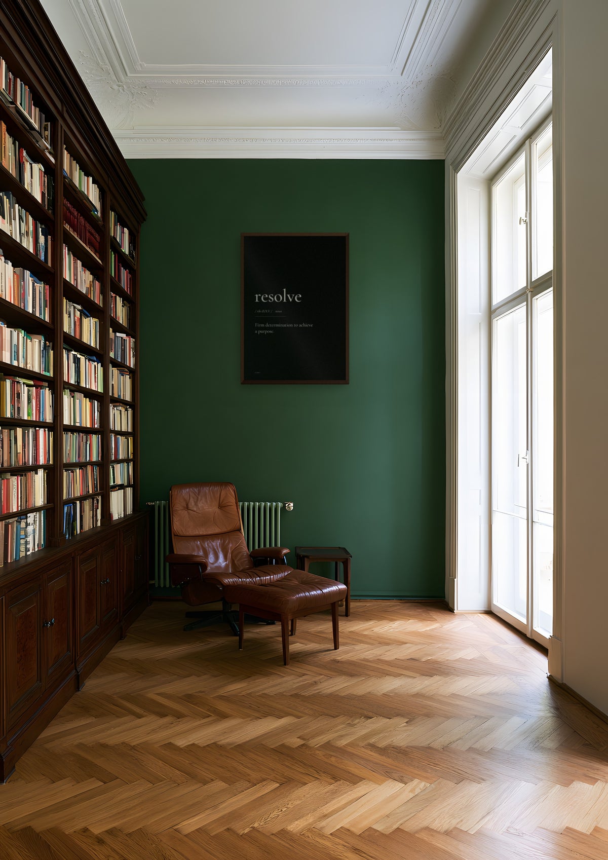 Resolve (Black) in a dark wood frame, shown in vienna-apartment-library