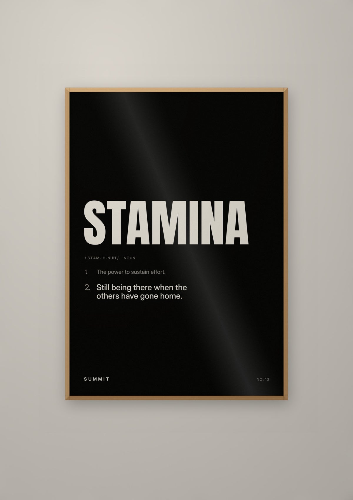Stamina, Defined (Black) in a natural wood frame