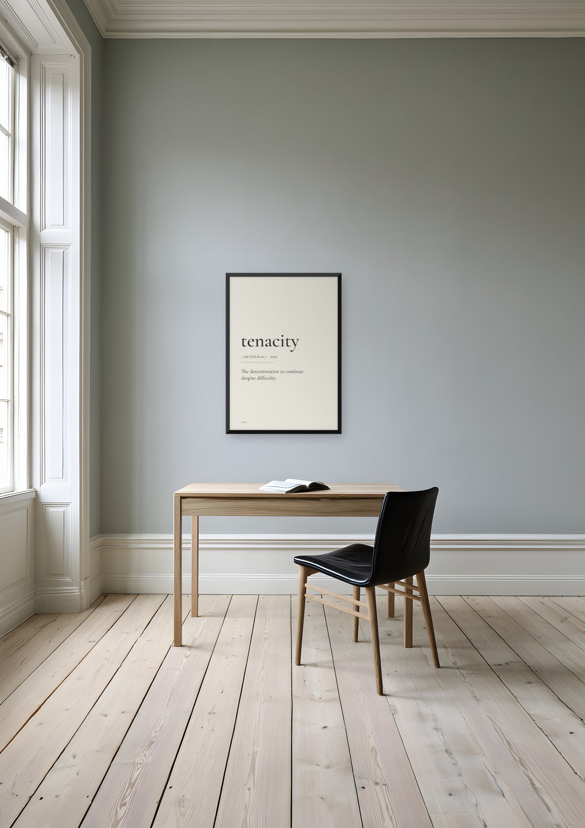 Tenacity in a black frame, shown in stockholm-apartment-study