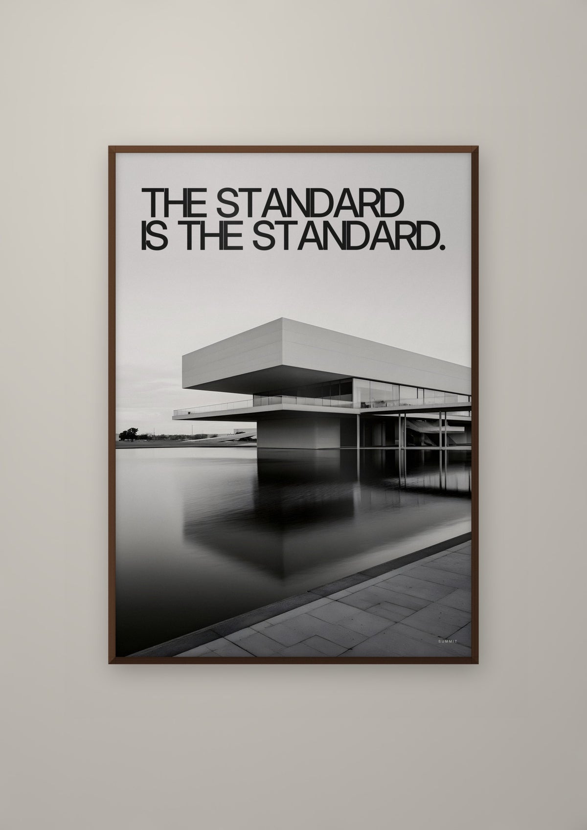 The Standard in a dark wood frame