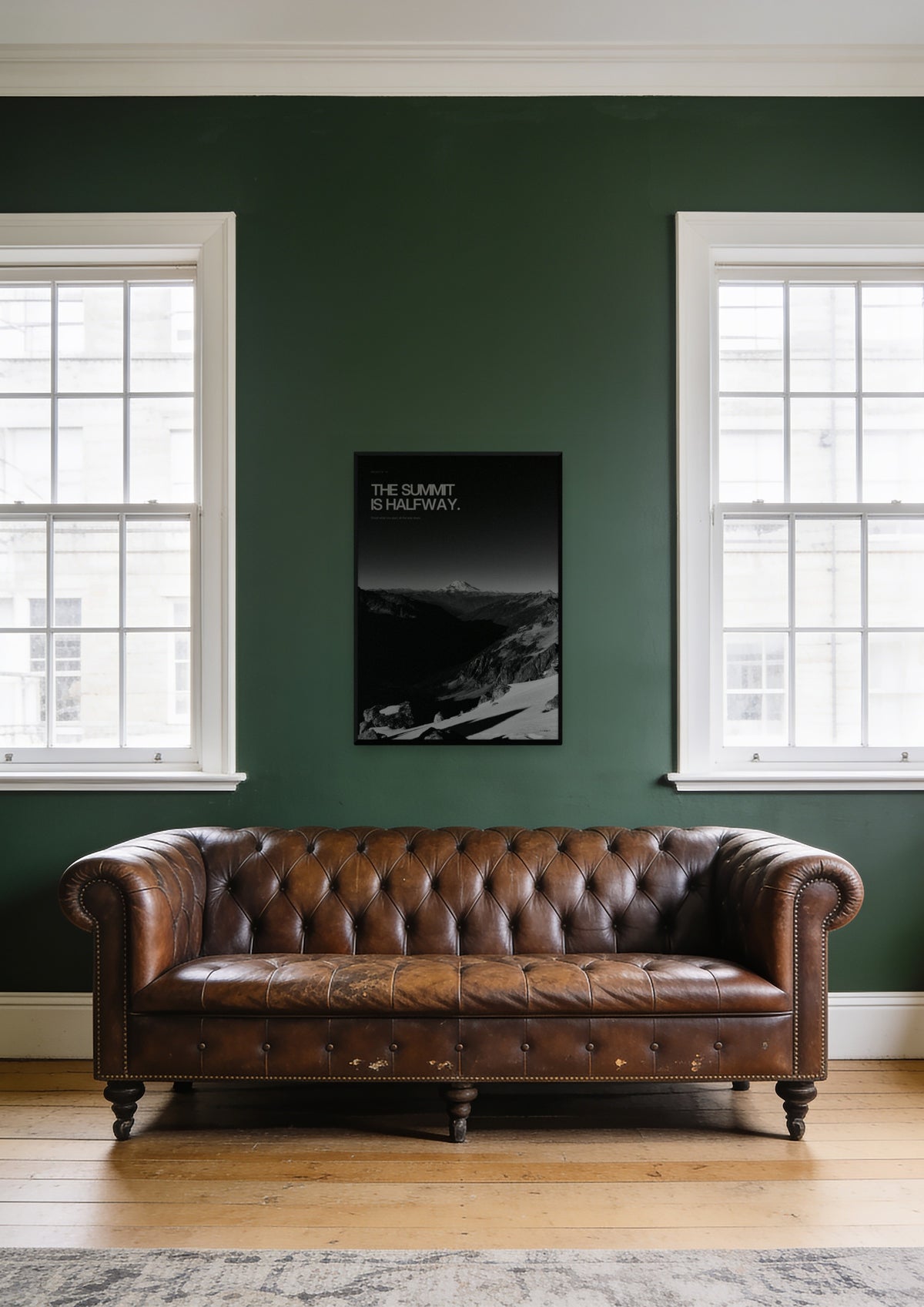 The Summit Is Halfway in a black frame, shown in a St James's club lounge