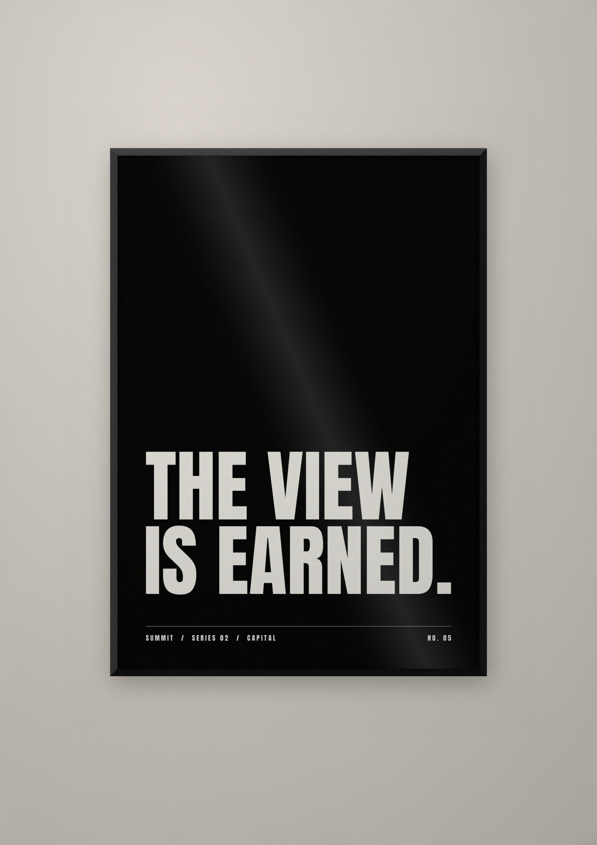 The View Is Earned in a black frame