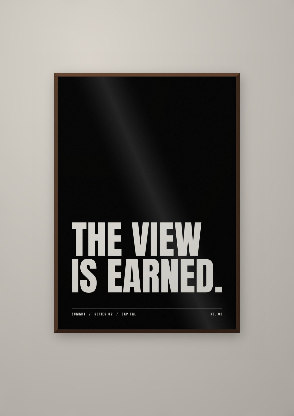 The View Is Earned in a dark wood frame