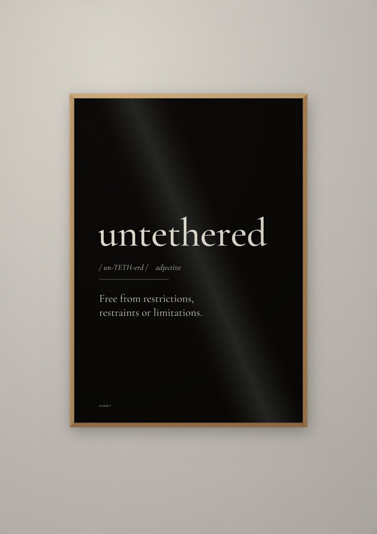 Untethered (Black) in a natural wood frame