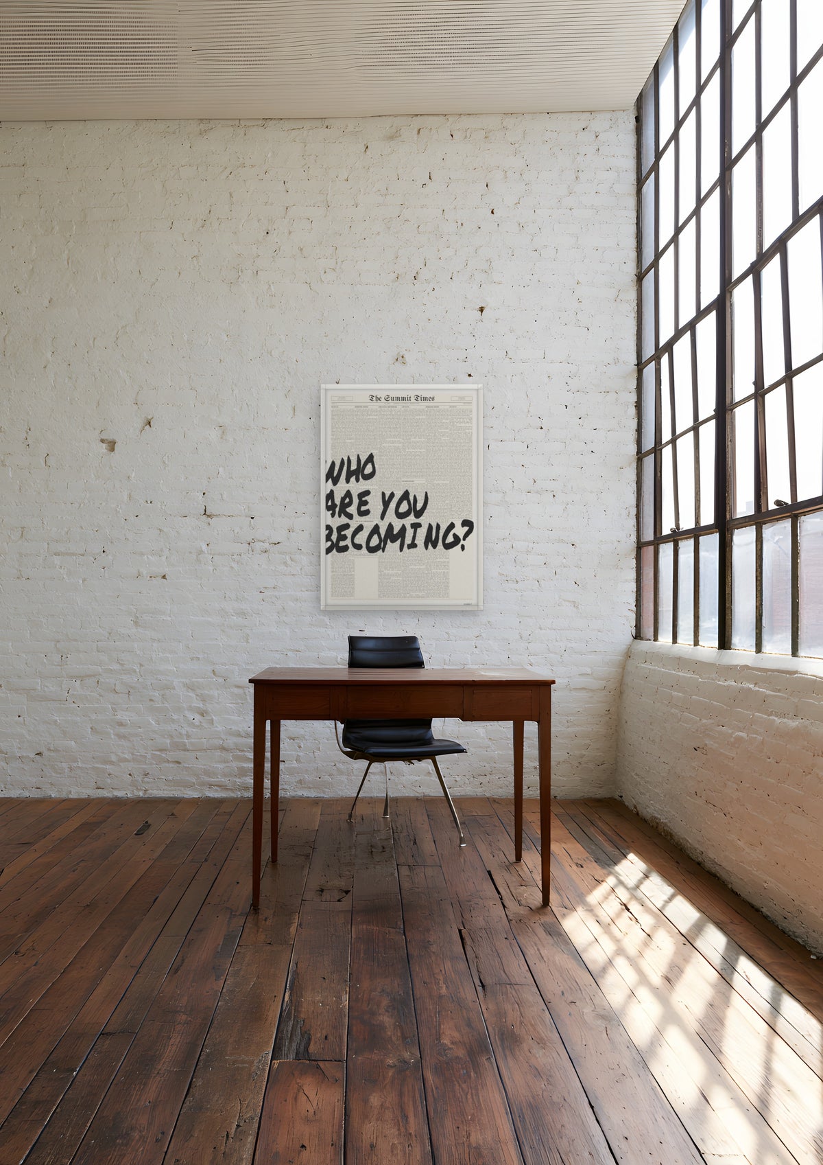 Who Are You Becoming? in a white frame, shown in brooklyn-loft-office